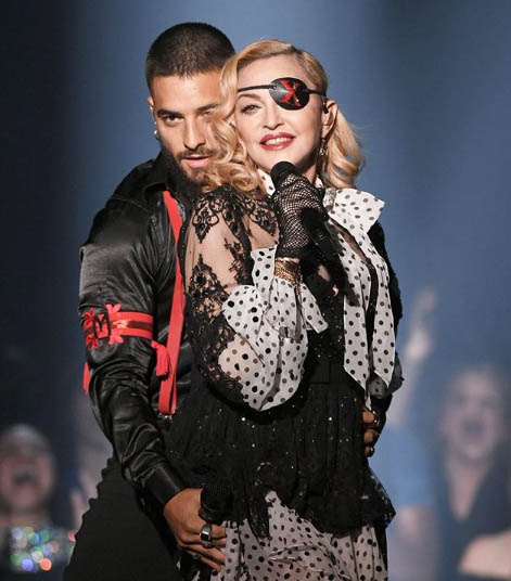 Madonna posting a picture of her live performance maluma.
